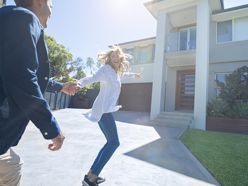 joyfull couple with their new home